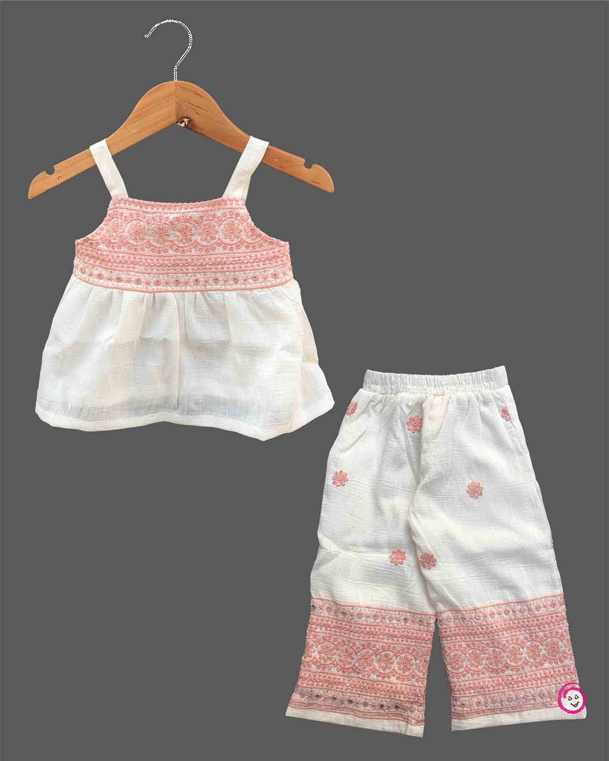 Baby girl embroidered cotton top and pant set featuring shoulder straps and matching wide leg pants for festive occasions