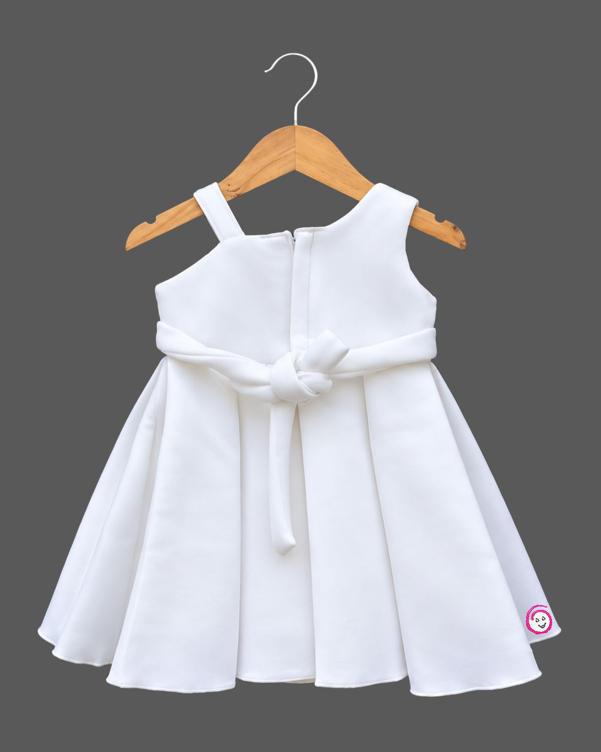 Baby girl scuba frock featuring structured box pleats and dimensional rose appliques for party wear