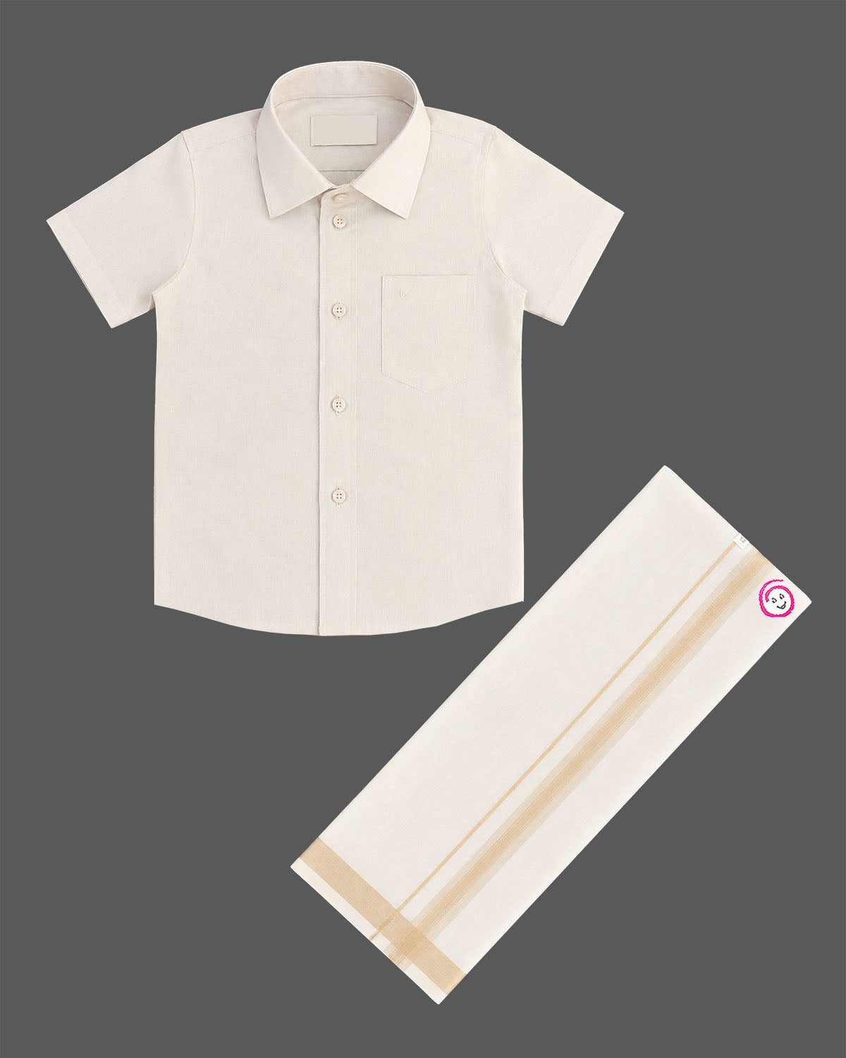 Little gentleman wearing traditional cotton shirt and dhoti for festive occasions