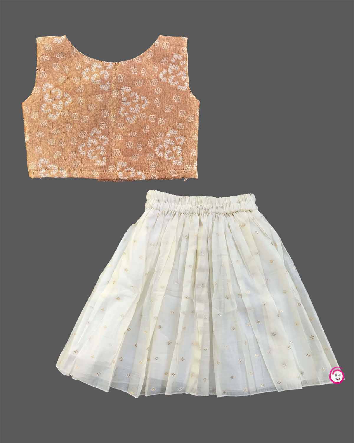Junior statement piece wearing woven pattern choli blouse and flared tissue skirt set for Onam