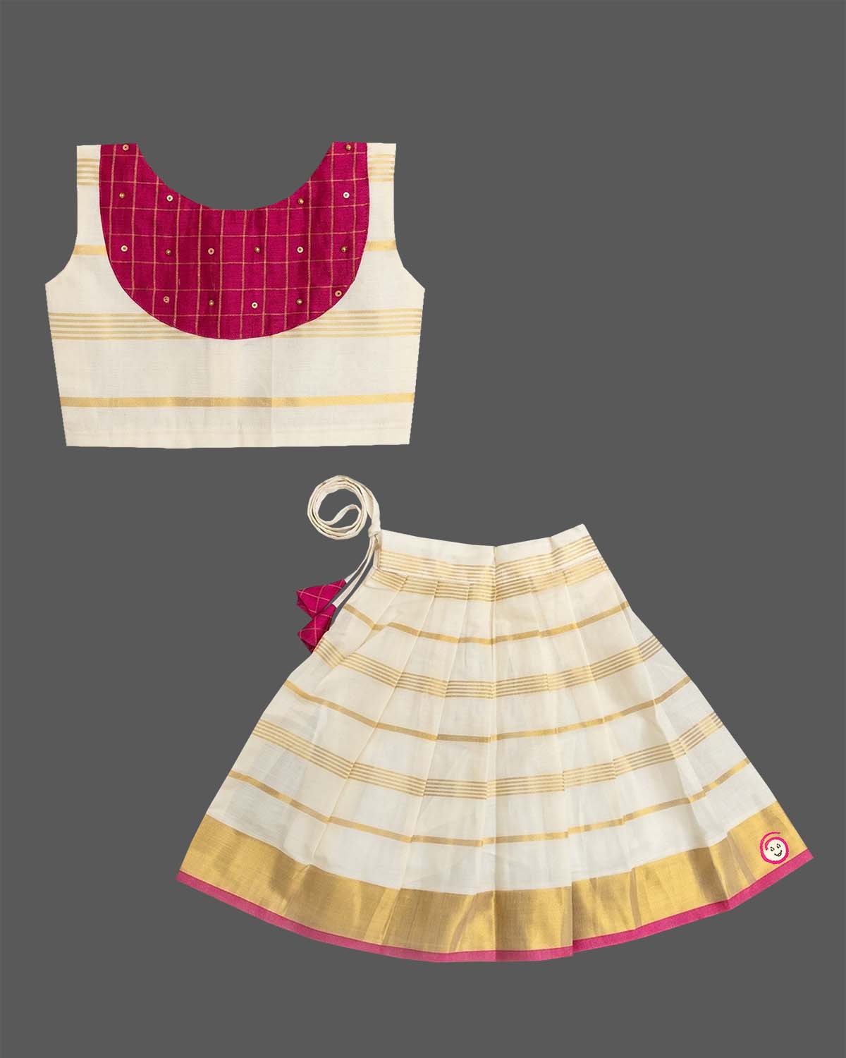 A sleeveless top with a checkered patch and a gold-striped skirt for Onam traditional wear.