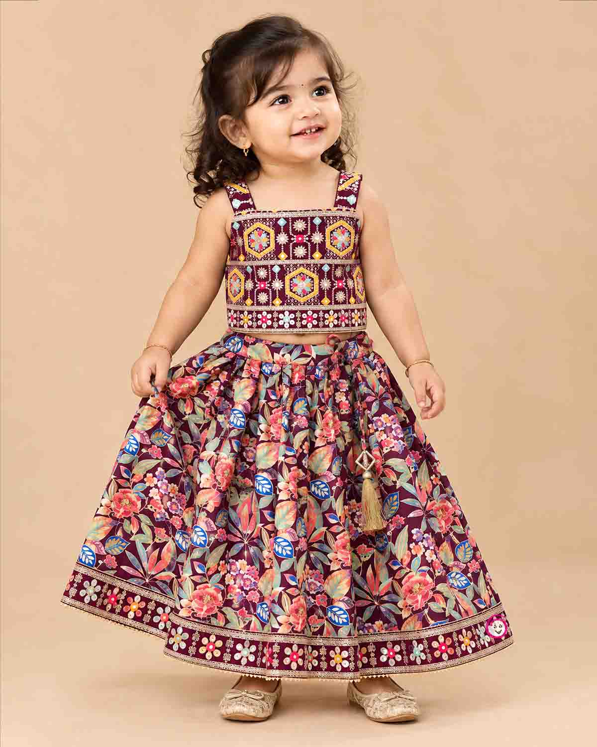 Geometric zari embroidered choli langa for kids set featuring mirror work choli and printed skirt