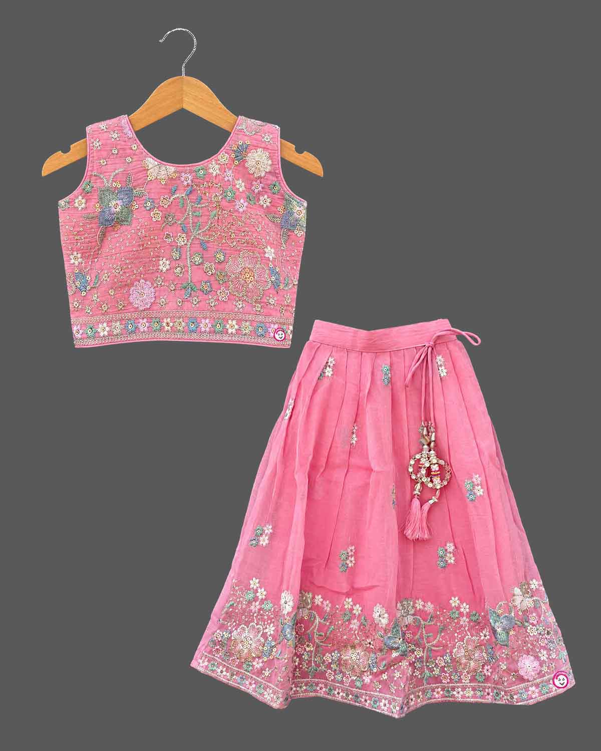 Floral embroidered lehenga choli for kids featuring flared skirt and net dupatta