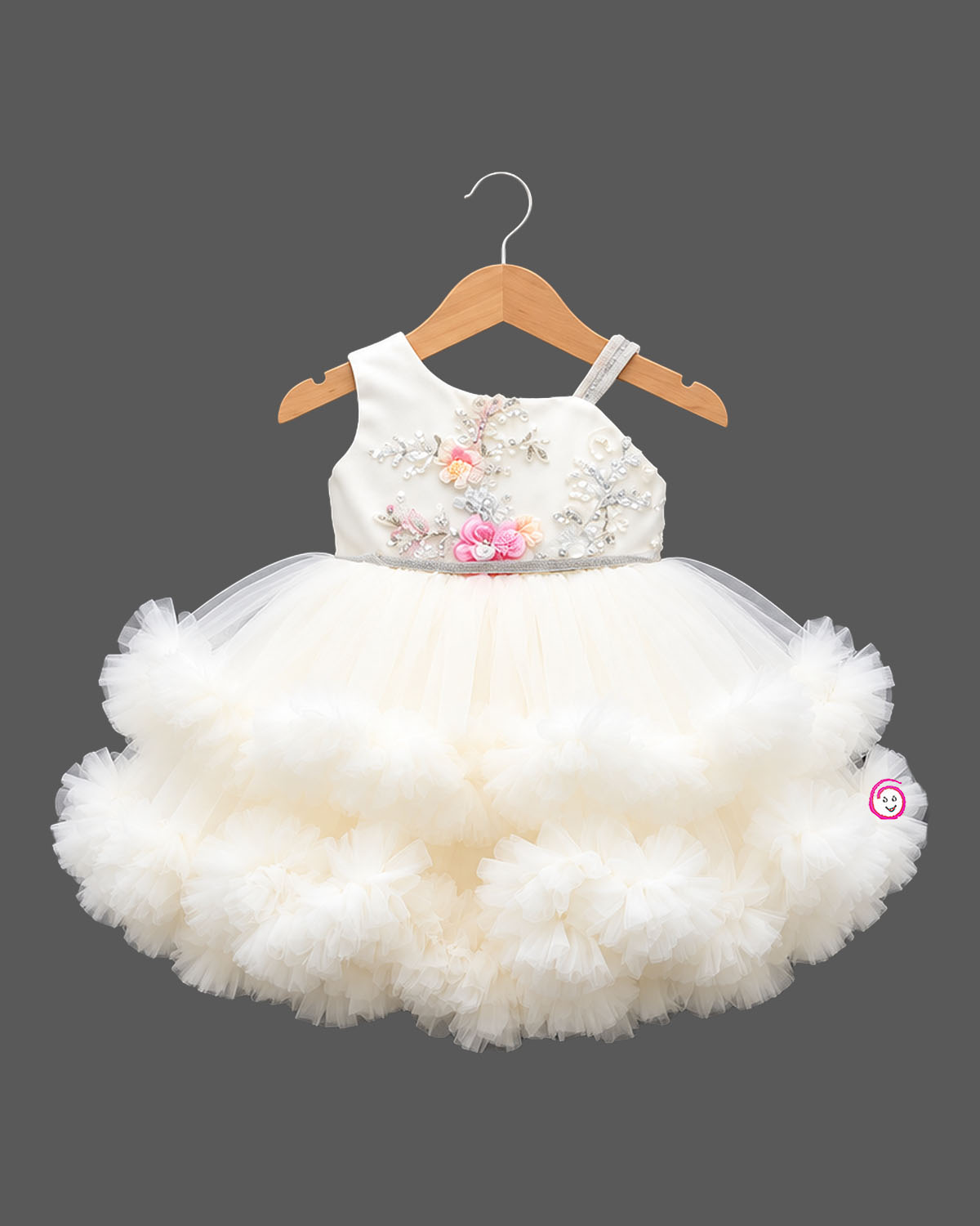 Embellished asymmetrical tulle silk frocks for baby girl featuring ruffled high-low hem.