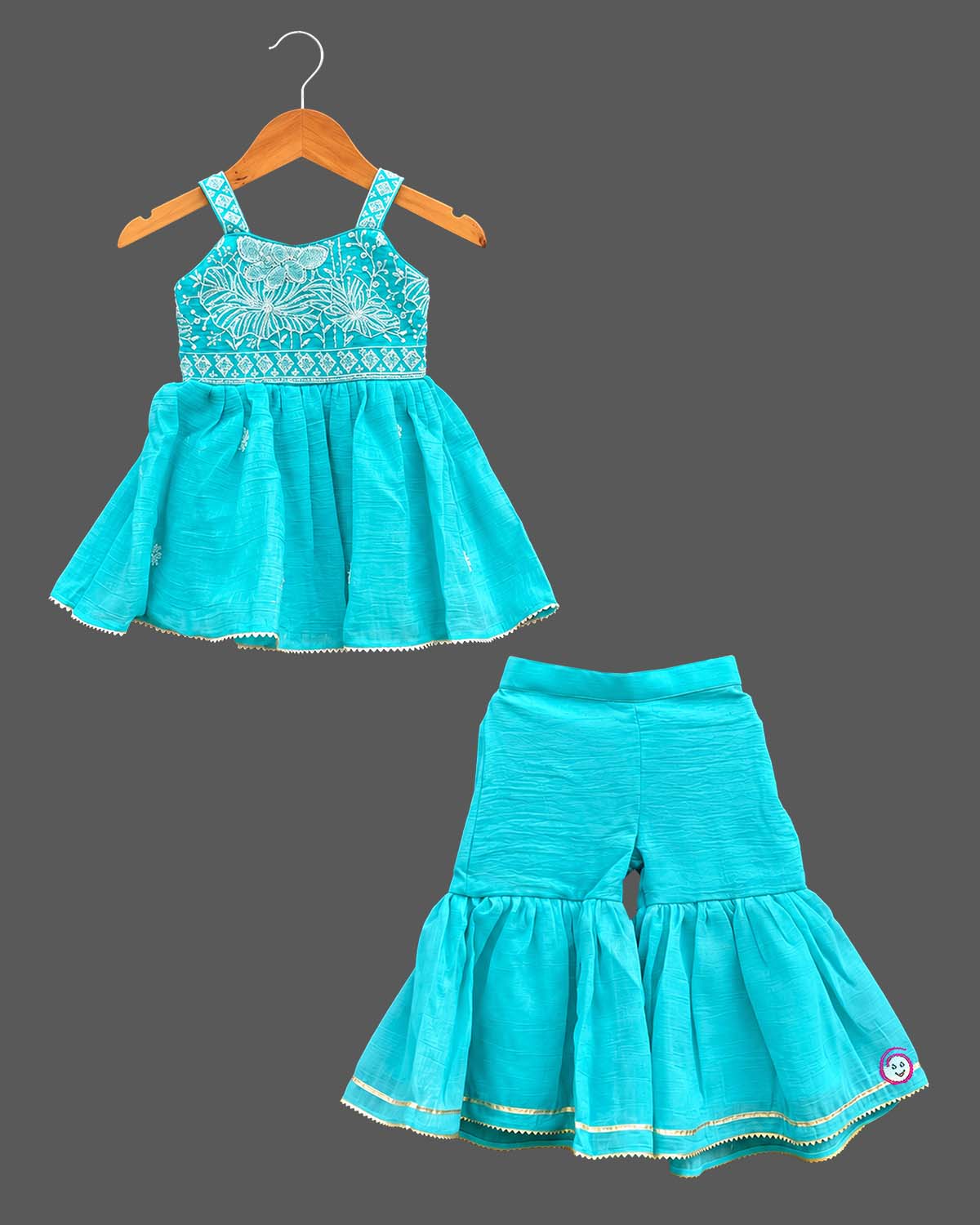 Kids sharara set with floral embroidered bodice, strappy peplum top and flared gota-trim sharara pants
