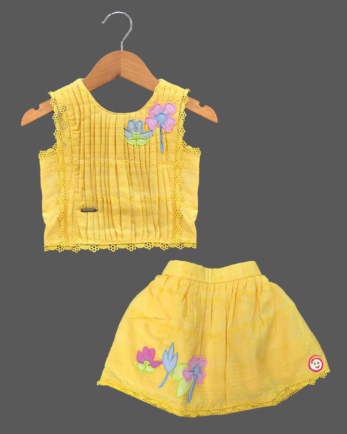 Toddler yellow cotton schiffli top and skirt set with floral appliques