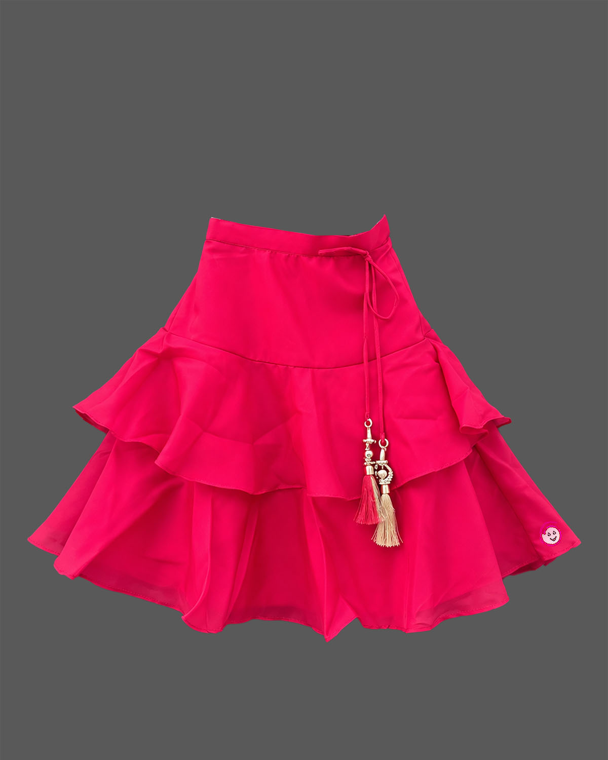 Girls floral embroidered sleeveless choli and tiered ruffle lehenga skirt set with drawstring tassel accents.