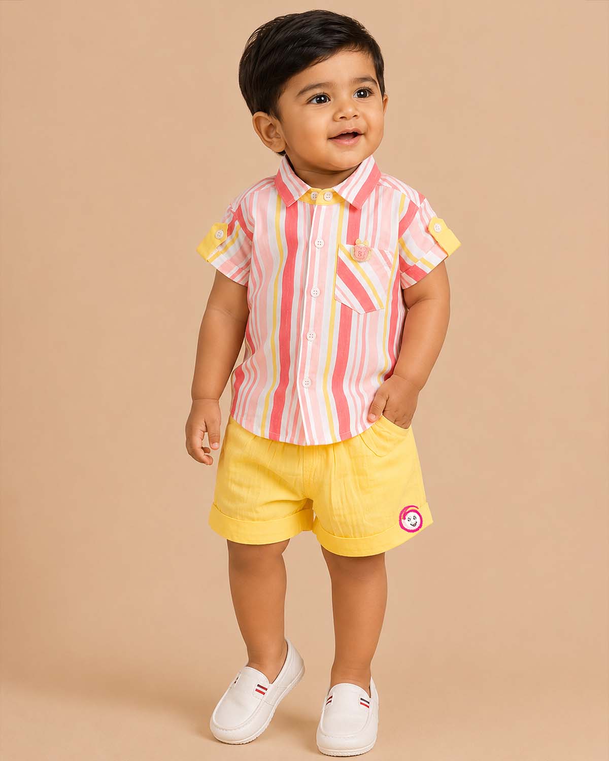 Boys 2-piece cotton casual set featuring a short-sleeve pink, yellow, and coral striped shirt and matching solid yellow elastic-waist shorts