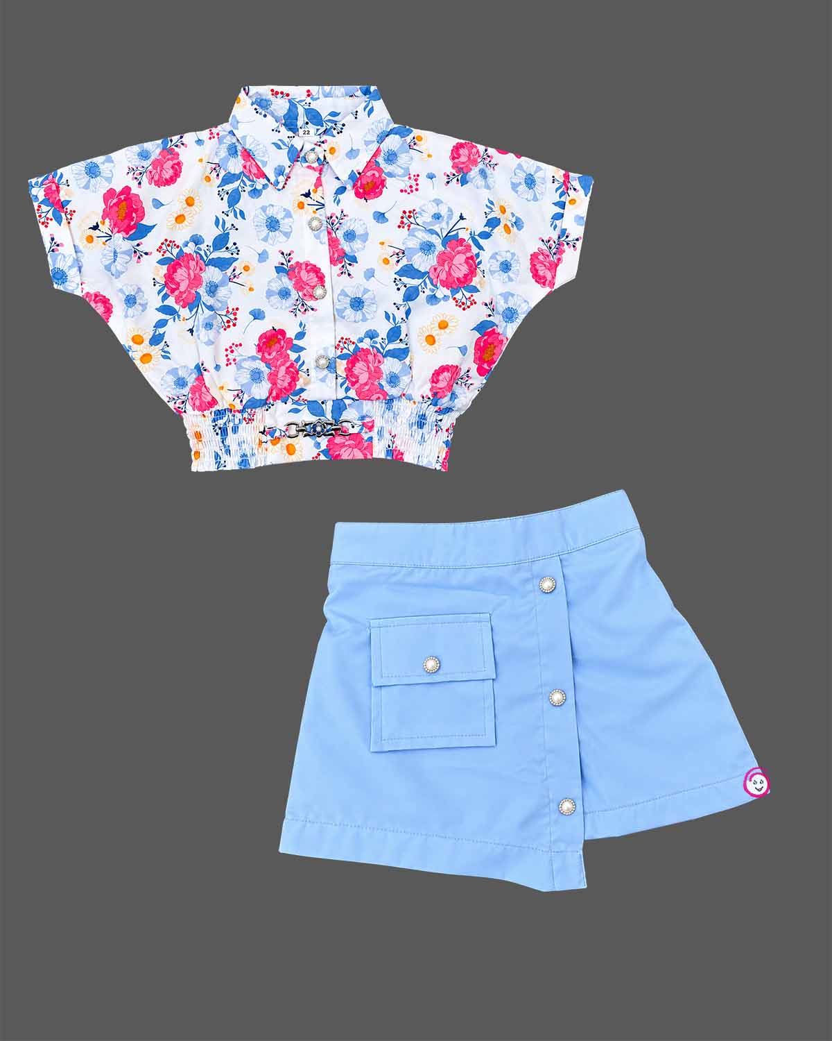 Floral shirt and buttoned wrap skort set styled as a baby party wear dress for girls