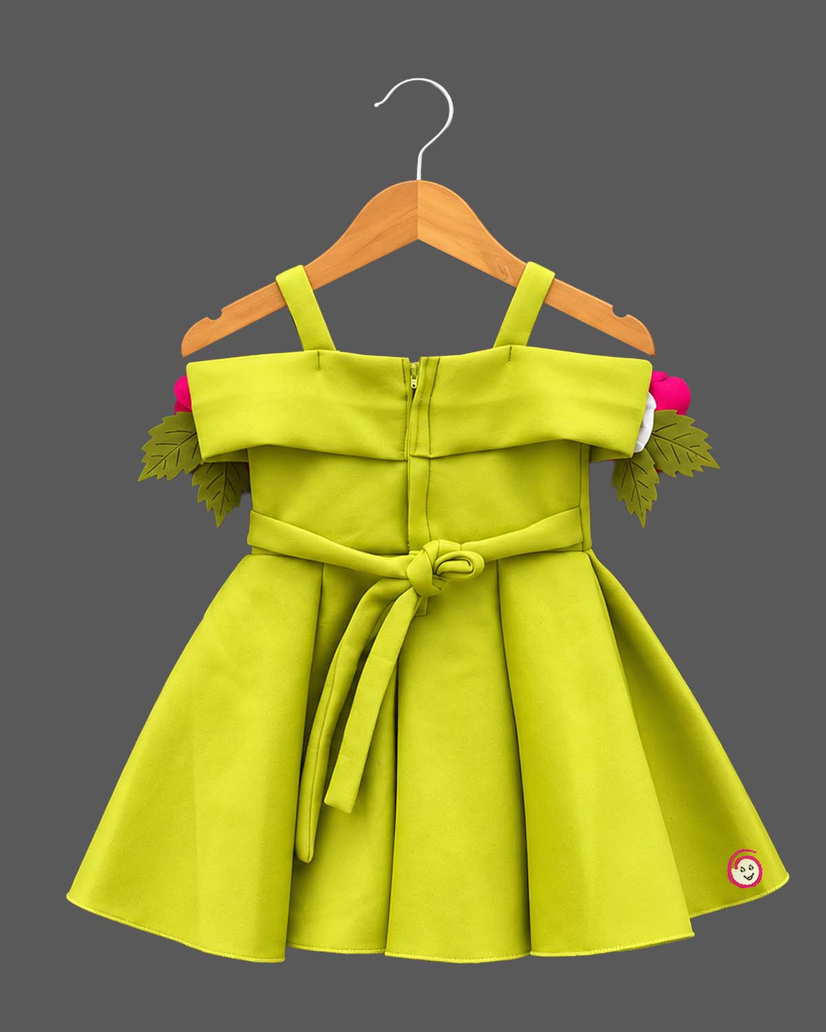 Baby party wear dress featuring oversized floral appliques and structured box pleats on a flared silhouette
