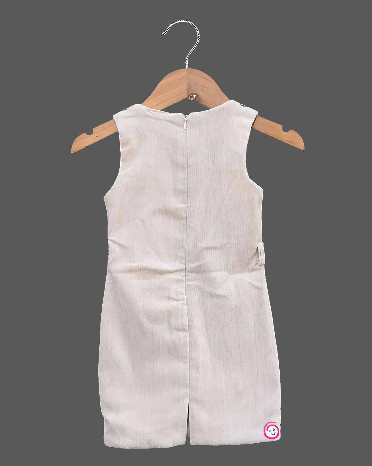 Black and white geometric jacket over a cream baby girl cotton midi dress for family dinners, evening outings, and smart casual wear