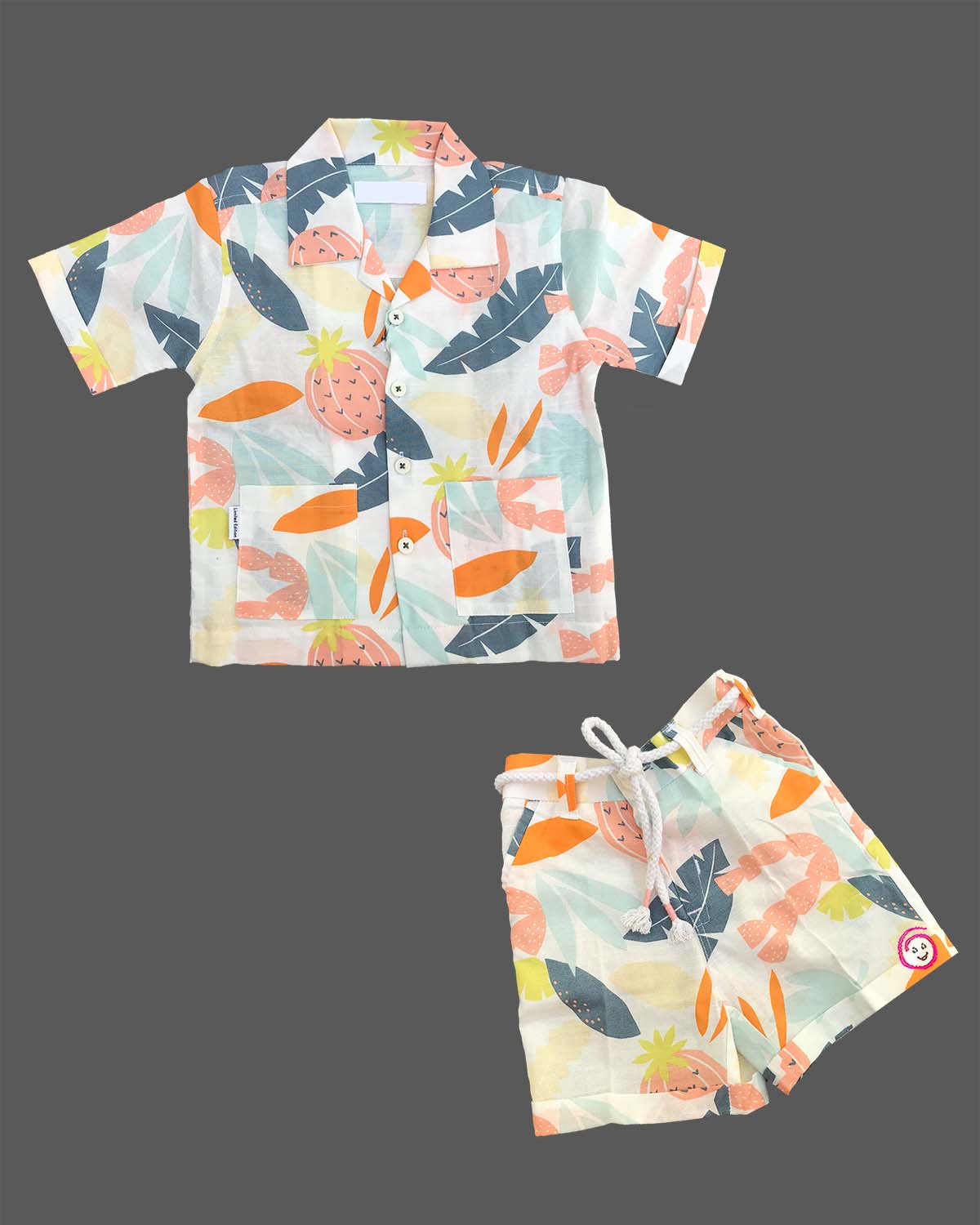 Boys Tropical Printed Pure Cotton Shirt & Shorts Co-ord Set featuring notch collar shirt with pockets and matching drawstring shorts.