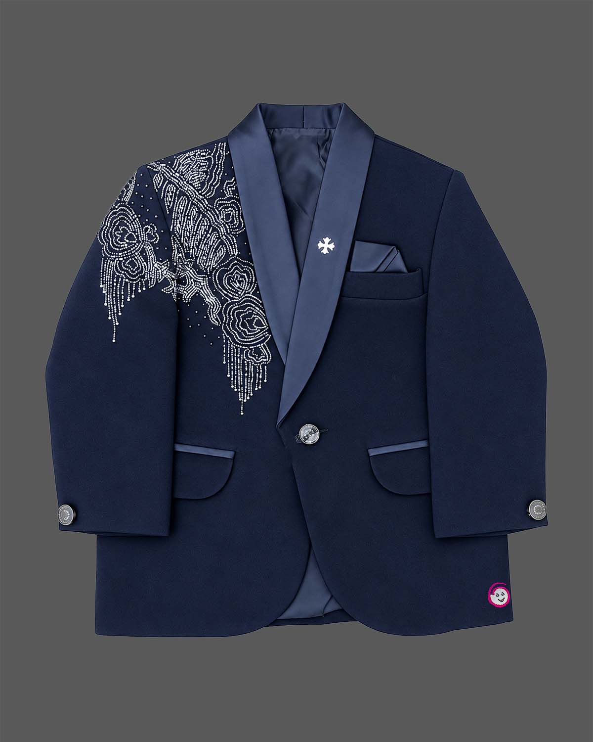 Blue boys formal suit with silver shoulder embroidery, white shirt, and bowtie