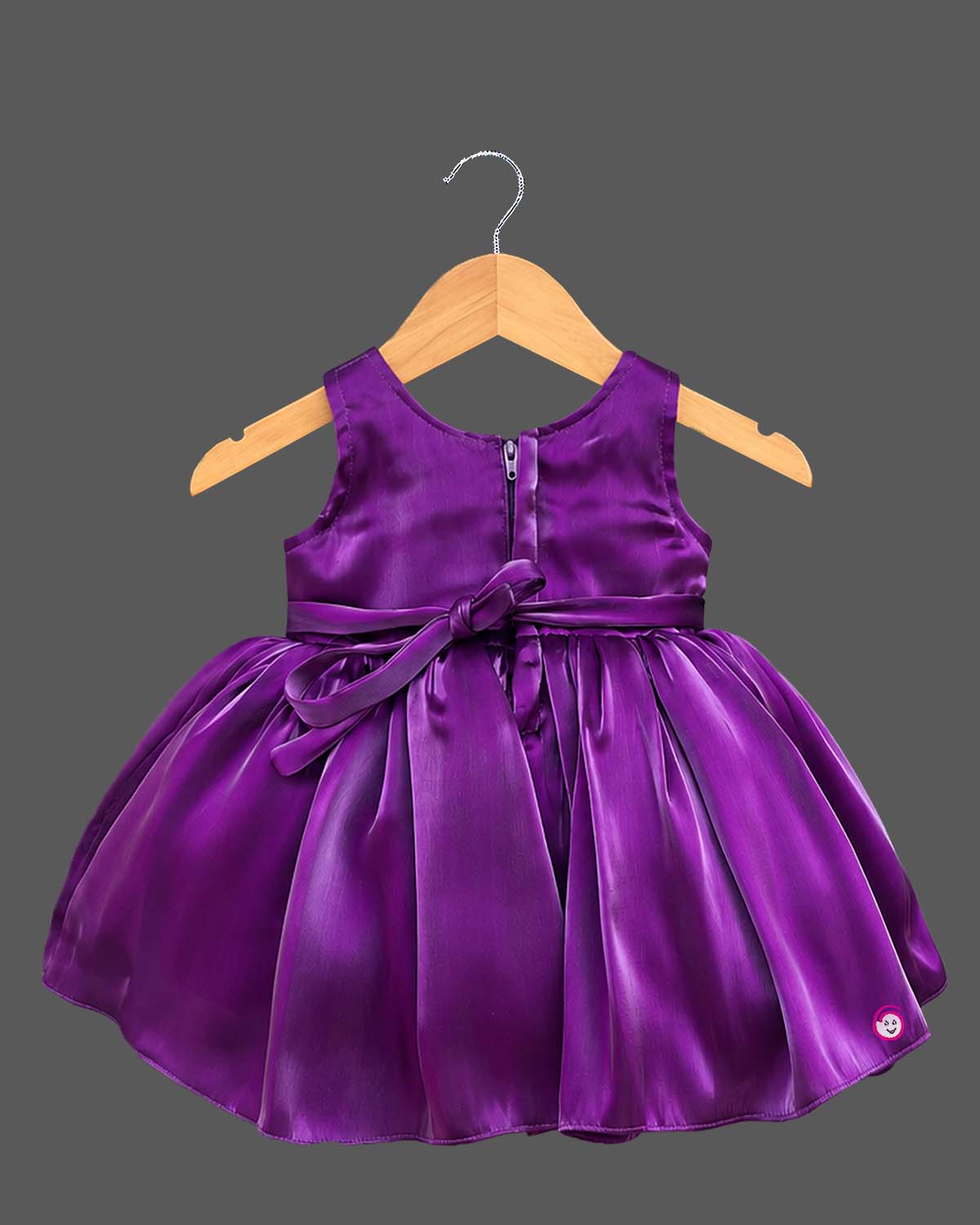 Baby party wear dress featuring a sleeveless satin fit and flare silhouette with front oversized bow and booties set.