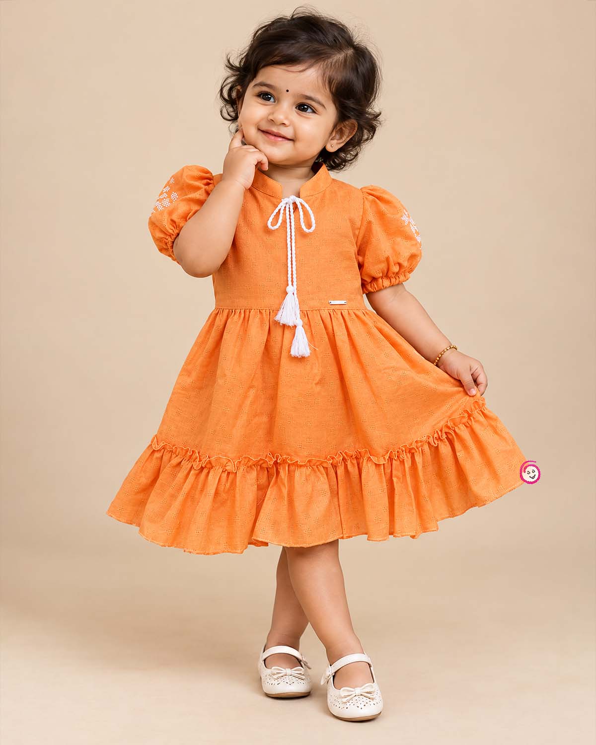 Orange cotton baby girl frock with puff sleeve and white embroidery detail