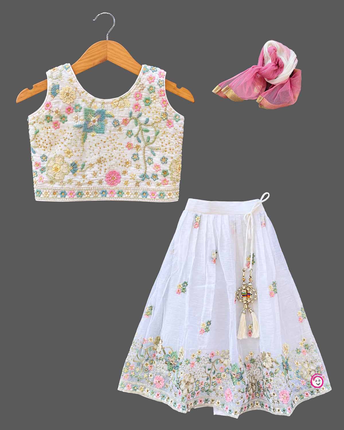 Hand-embroidered lehenga choli for kids with sleeveless choli, flared skirt, and dupatta.