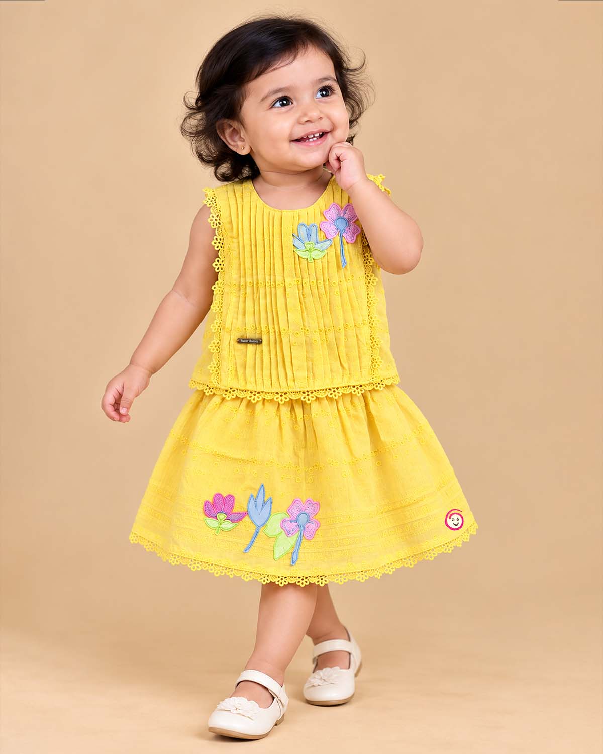 Toddler yellow cotton schiffli top and skirt set with floral appliques