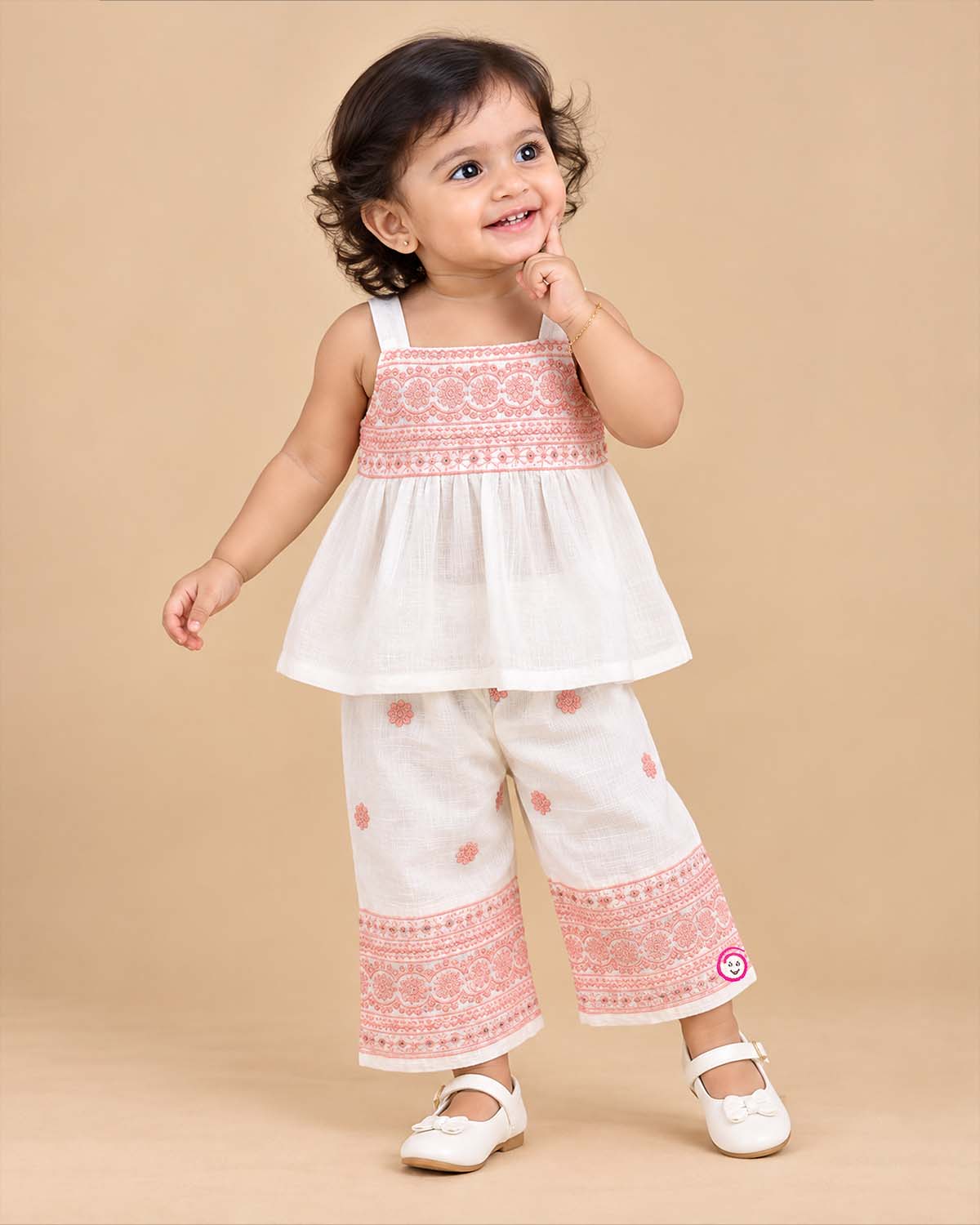 Baby girl embroidered cotton top and pant set featuring shoulder straps and matching wide leg pants for festive occasions
