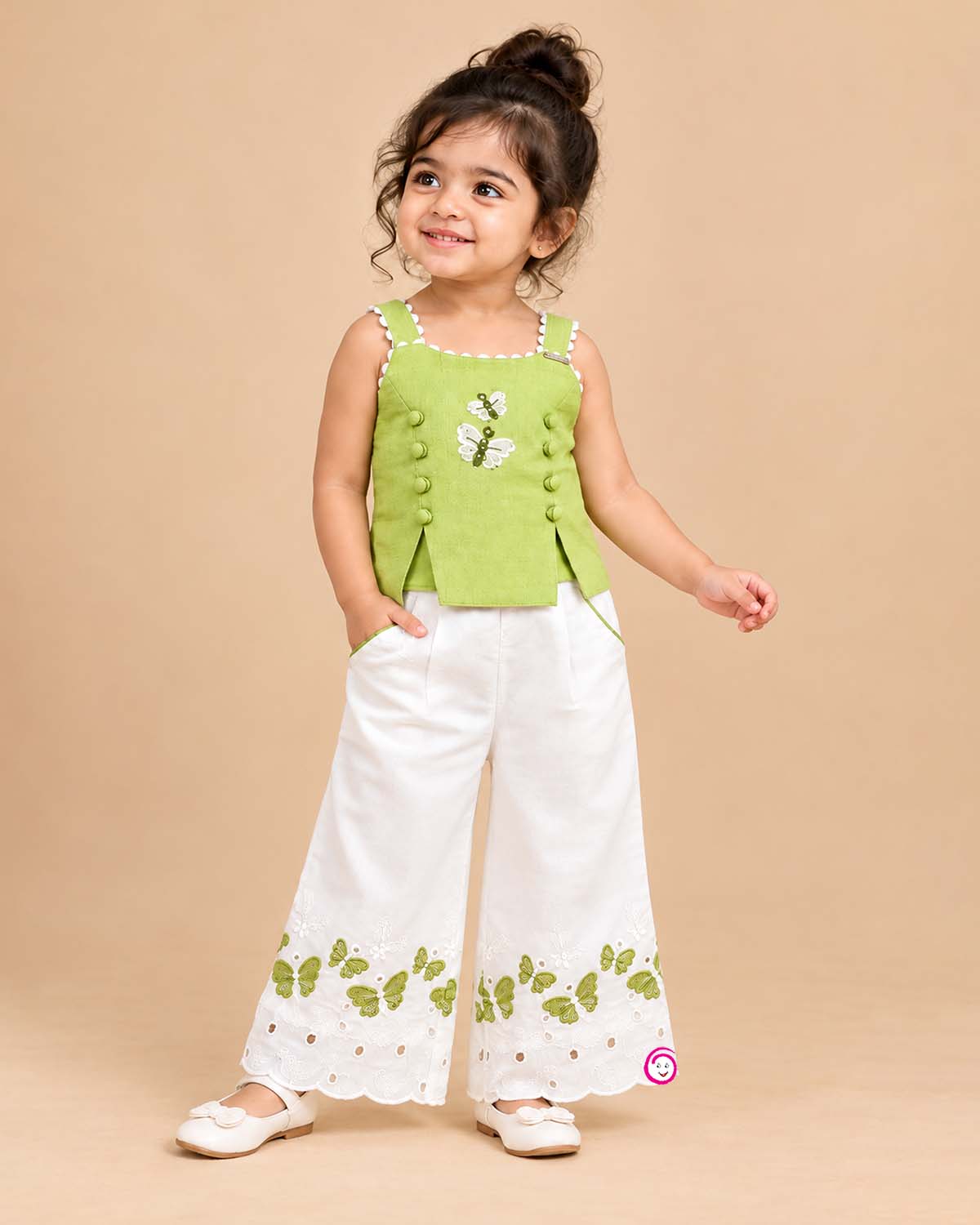 Sleeveless embroidered top with butterfly motifs and matching pleated pants with scalloped hems