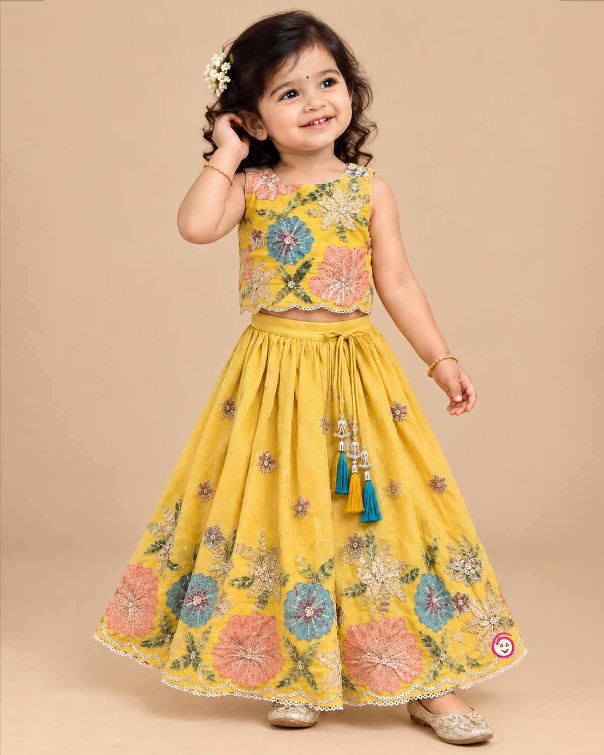 Embroidered lehenga choli for kids featuring scalloped floral sequin work and drawstring tassel ties