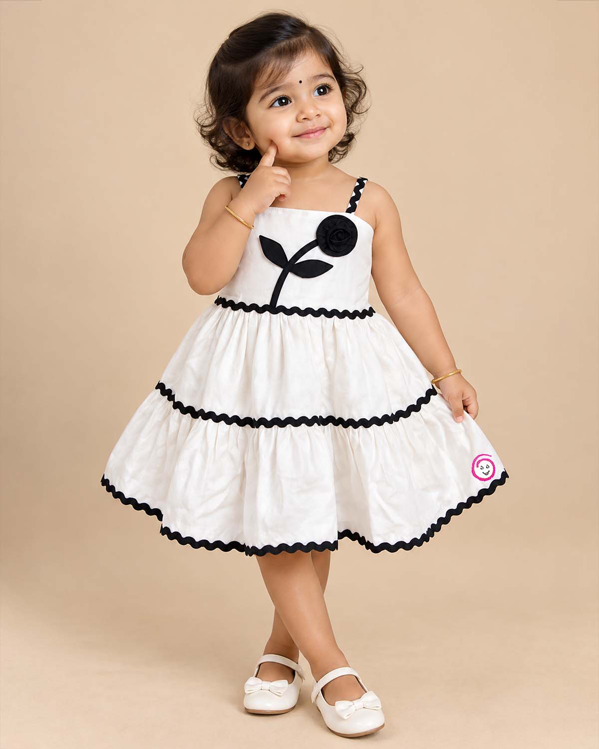 Baby Girl Tiered Frock with flower applique and zig-zag trim detailing for birthday Western wear .