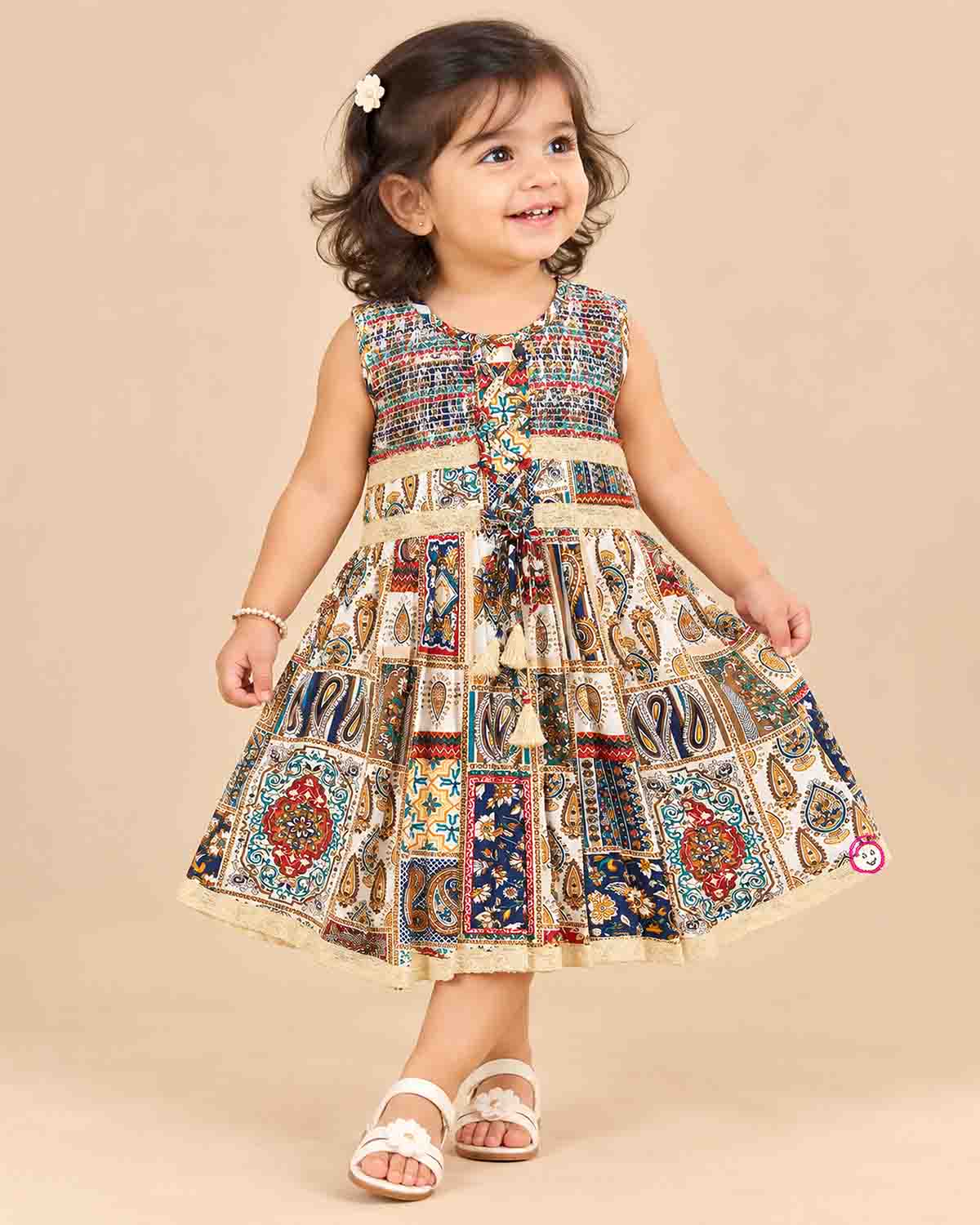 Toddler printed cotton frock with smocked neck and front lace tie ups for casual outing and birthday celebration