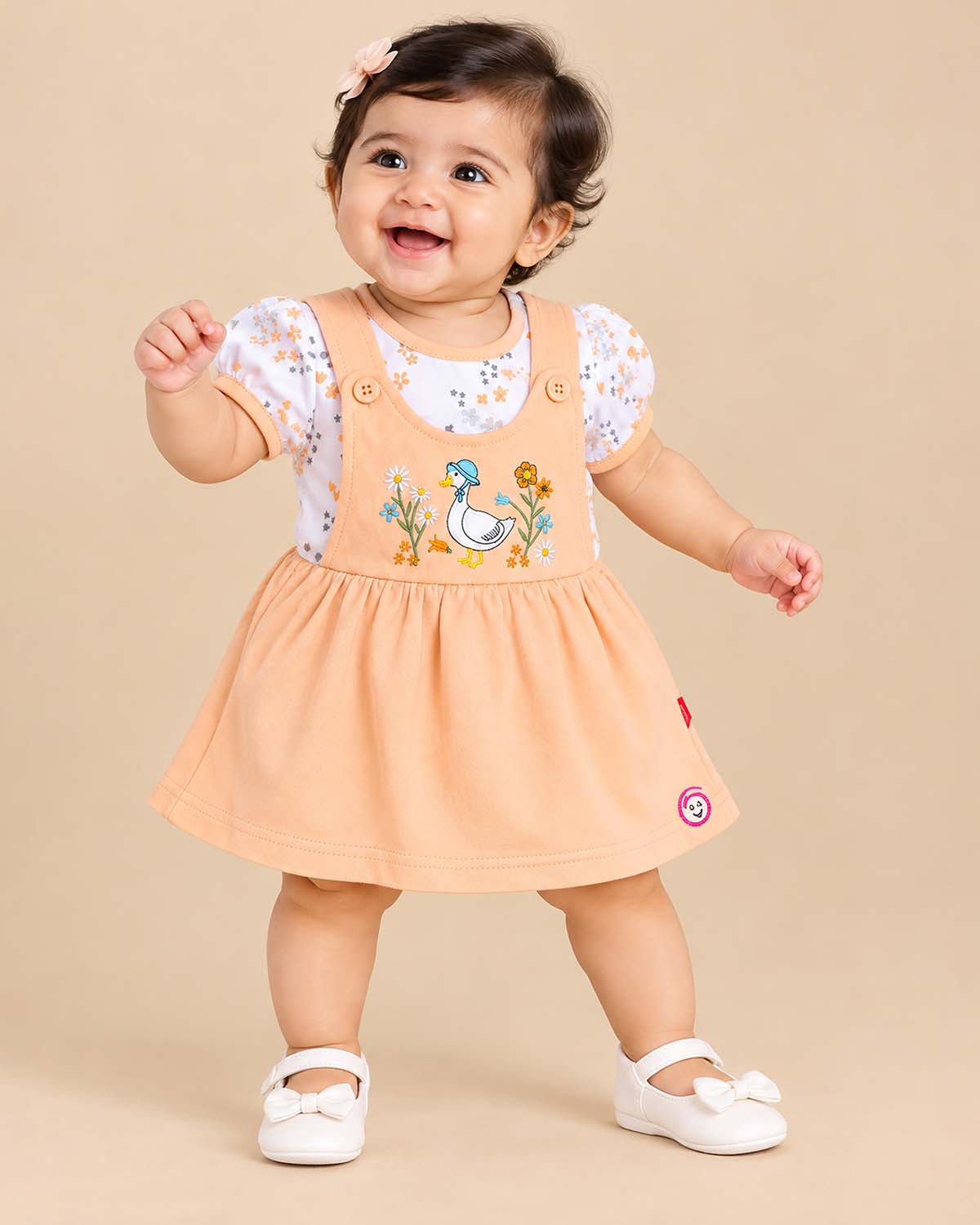 Floral print layered infants frock with duck embroidery on front bib
