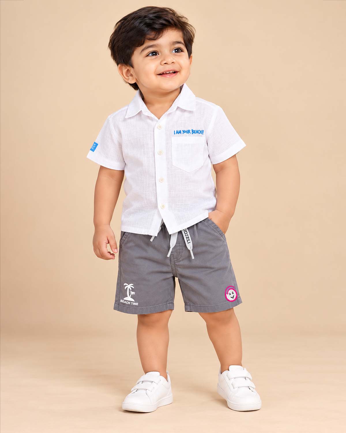 Button down shirt and shorts set styled as western dress for boys with chest embroidery.