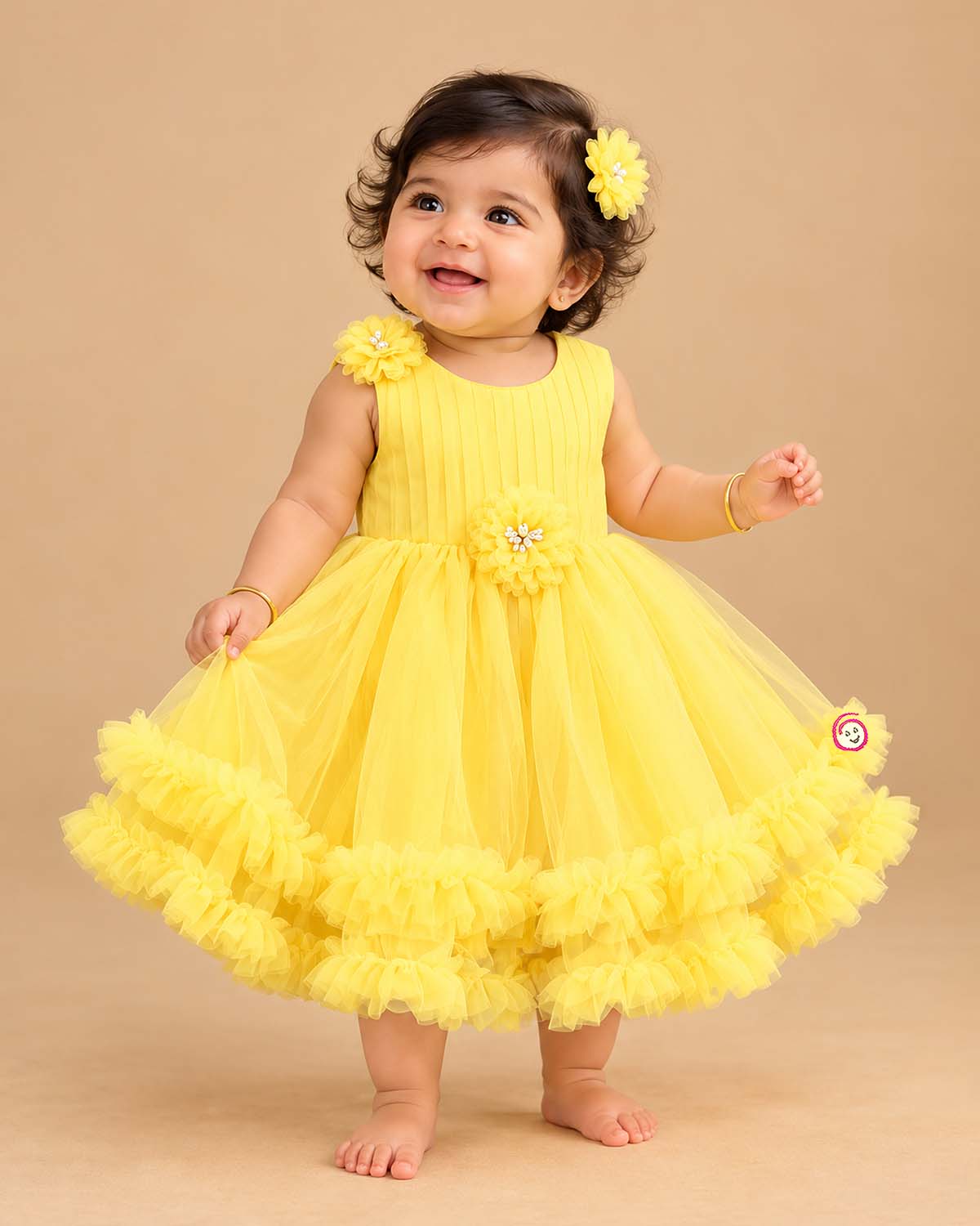 Sleeveless pleated bodice tulle frock with ruffled tiered hem and waist floral appliqué accent.