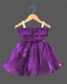 Deep purple satin and organza party frock for baby girl featuring oversized side bow, rhinestone shoulder straps, and crystal brooch for first birthday outfit for girl and wedding celebrations