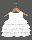 White tiered ruffled baby girl party wear frock with butterfly applique for birthdays, weddings, and special occasions