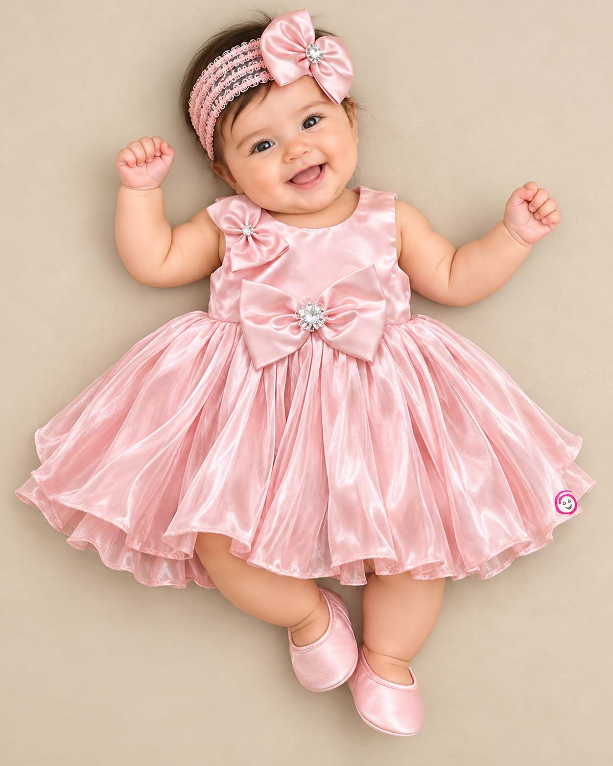 Baby girl satin party frock with bow accent and crystal embellishment for birthday celebration