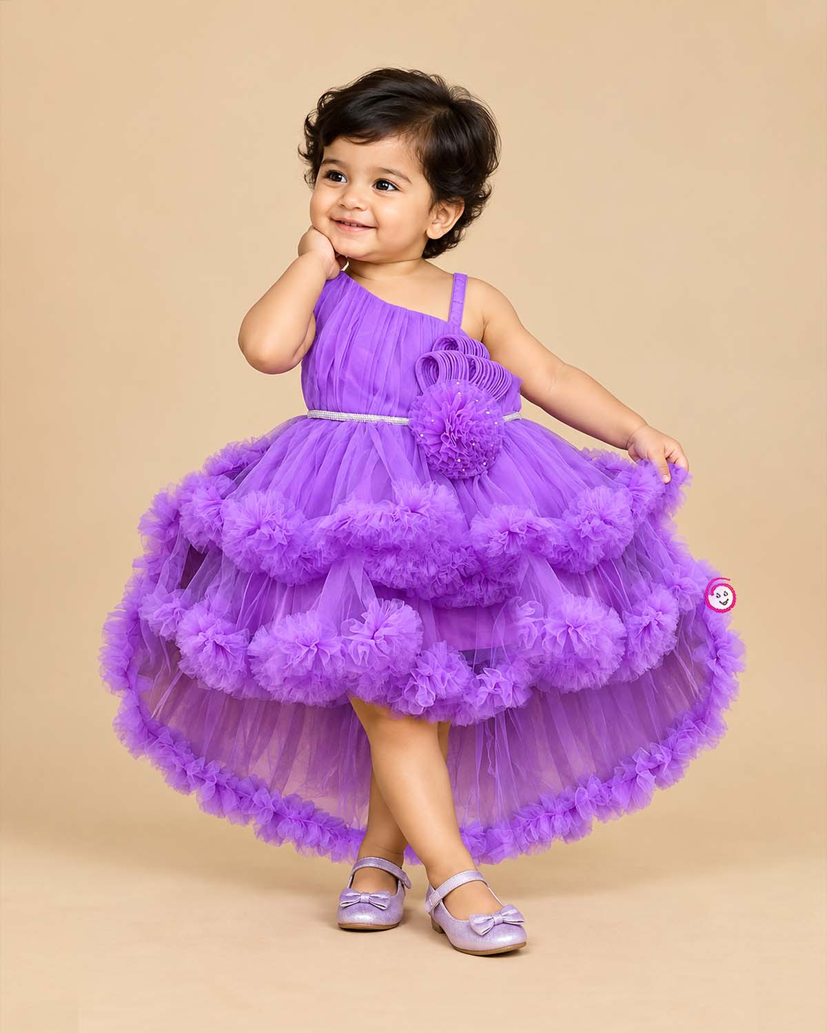 Purple net frock with layered ruffles and floral embellishment for girls