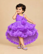 Purple net frock with layered ruffles and floral embellishment for girls