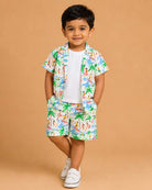 Vibrant tropical beach print muslin open-front shirt and matching shorts set featuring palm trees and surfer motifs for baby boys and toddler summer vacation wear