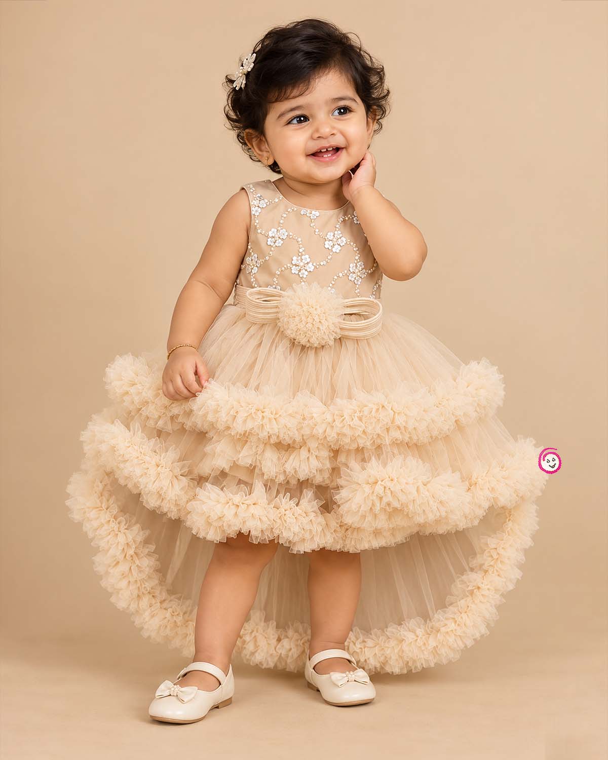 Beige cream net party frock for girls featuring sequin floral embroidery, sleeveless bodice, and tiered ruffle high-low hem design