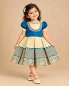 Toddler kids silk cotton frock ethic wear featuring embroidered round neck, puffed sleeves, and bordered skirt.