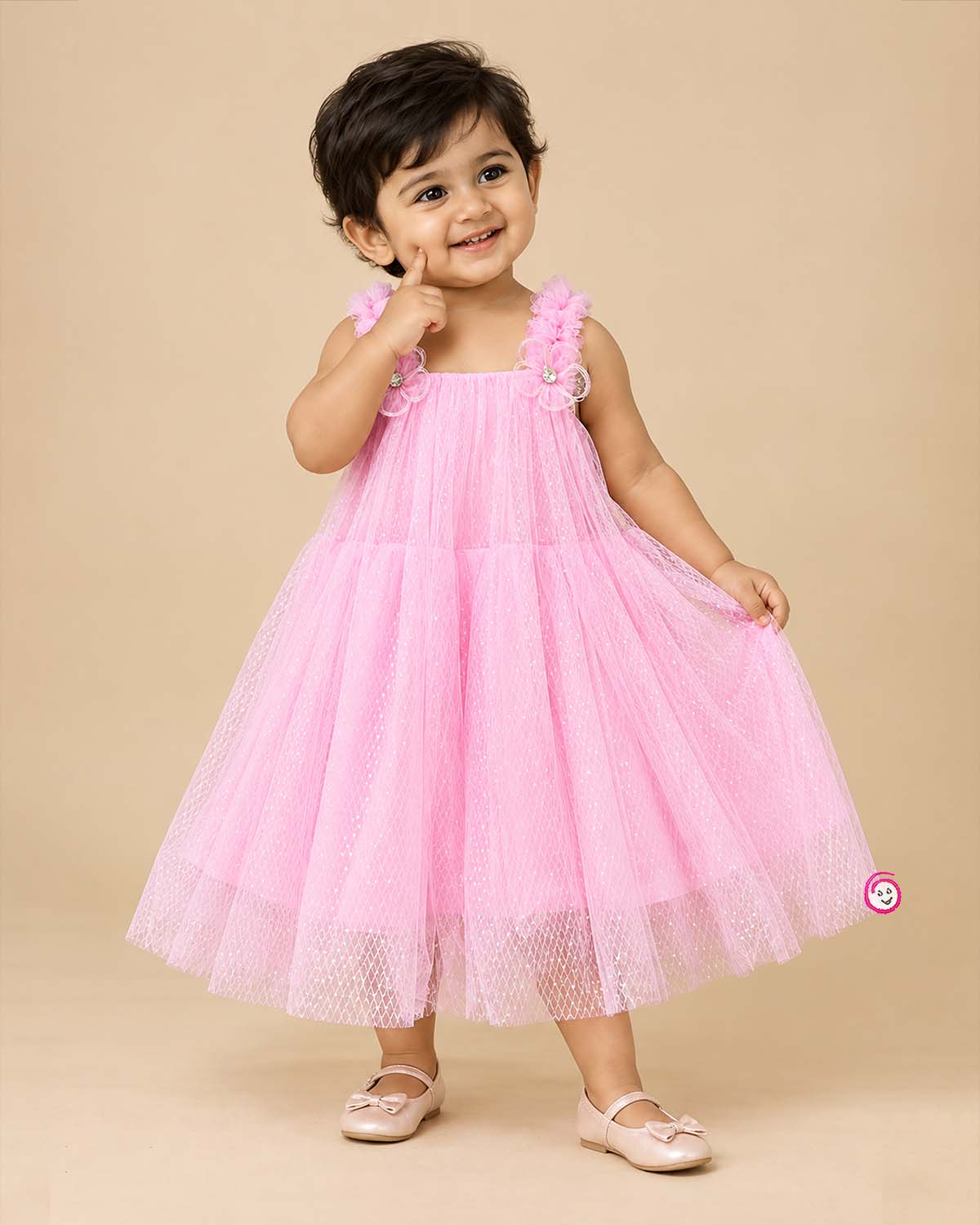 Little princess pink net frock with shimmer tulle overlay and floral shoulder embellishments for party wear