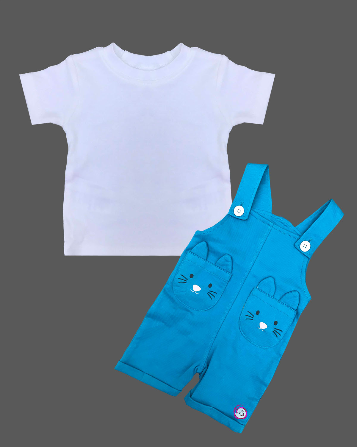 Toddler boy wearing comfortable cotton dungaree shorts featuring cute animal face pockets and a crew neck t-shirt.