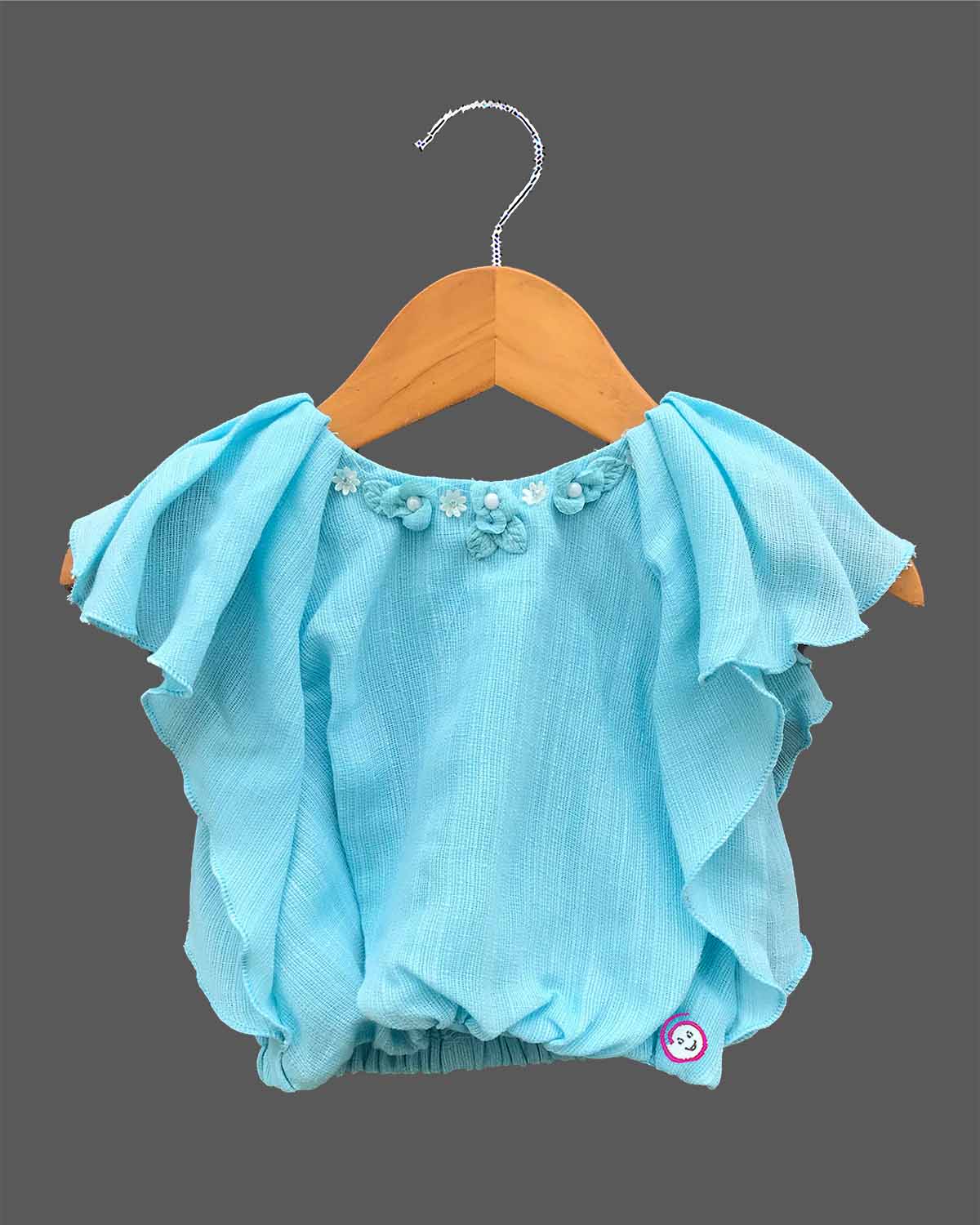 Trendy flutter sleeve top paired with an embroidered A-line skirt, a stylish party attire for toddlers and young fashionistas.