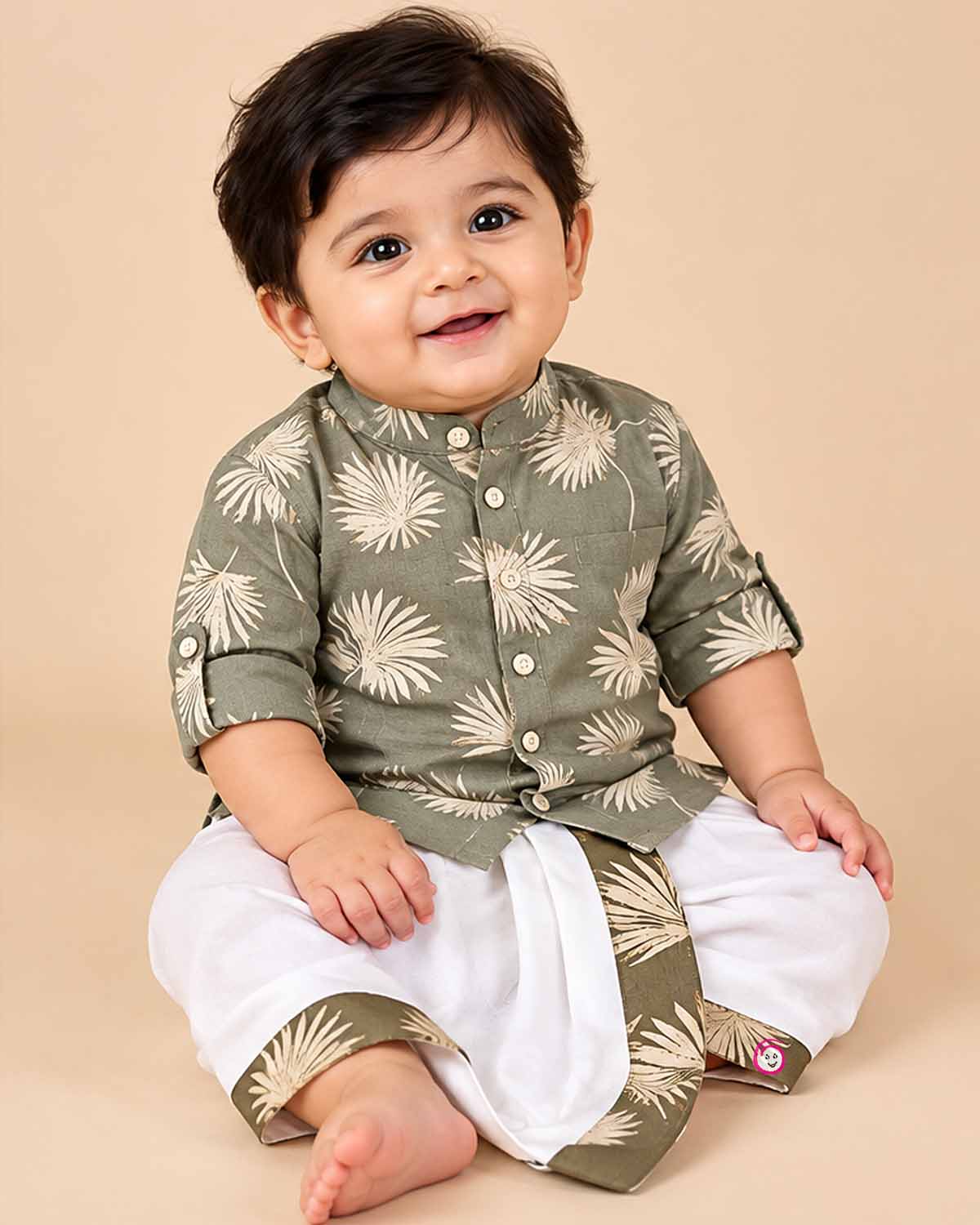 Baby boy ethnic kurta pant set featuring botanical leaf prints, mandarin collar, and roll-up sleeves.