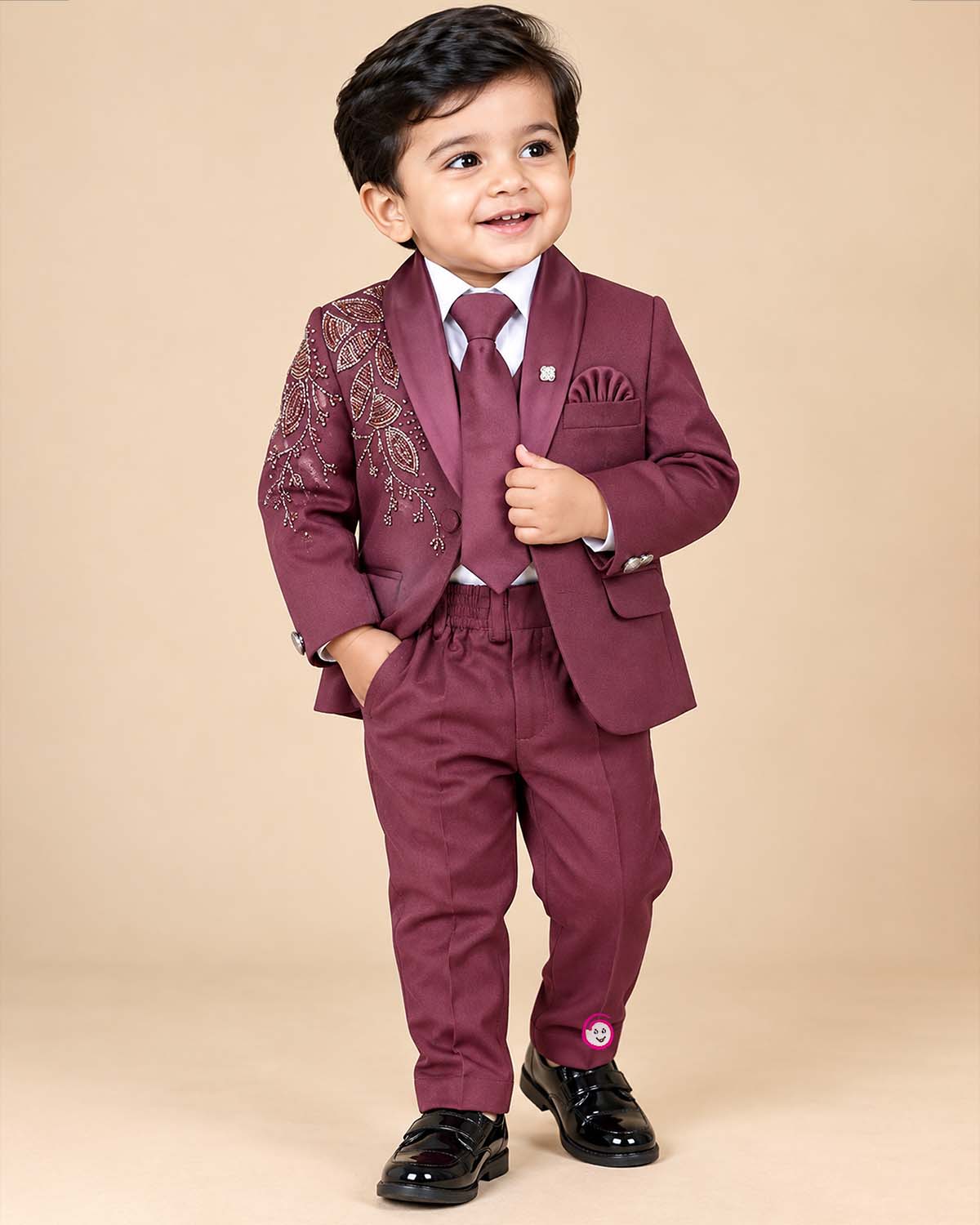 Boys tailored three-piece suit set featuring structured blazer, button-down shirt, and dress pant for events.
