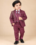 Boys tailored three-piece suit set featuring structured blazer, button-down shirt, and dress pant for events.
