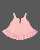 Infant cotton ruffle top with frill hemline and decorative charm detail for baby girl party wear