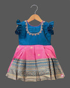 Baby Girl Silk Cotton Frock with Pattu Pavadai traditional border and embroidered neck for festive ethnic wear