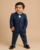 Boys navy blue formal tuxedo blazer with sequin embellishments, satin , bow tie, brooch pin, paired with elastic waist formal pant
