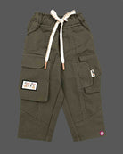 Trendy utility cargo pant for toddler boys featuring multi-flap pockets, graphic patch detail, and a thick braided drawstring waist.