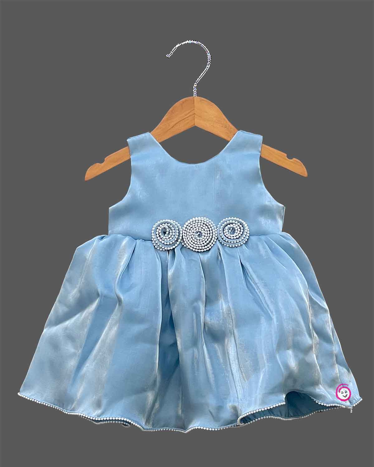 Powder blue satin frock for girls featuring floral beaded waist embellishments and pearl trim hem
