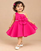 Structured one-shoulder kids party wear frock set with large 3D flower applique, soft booties, and bow headband