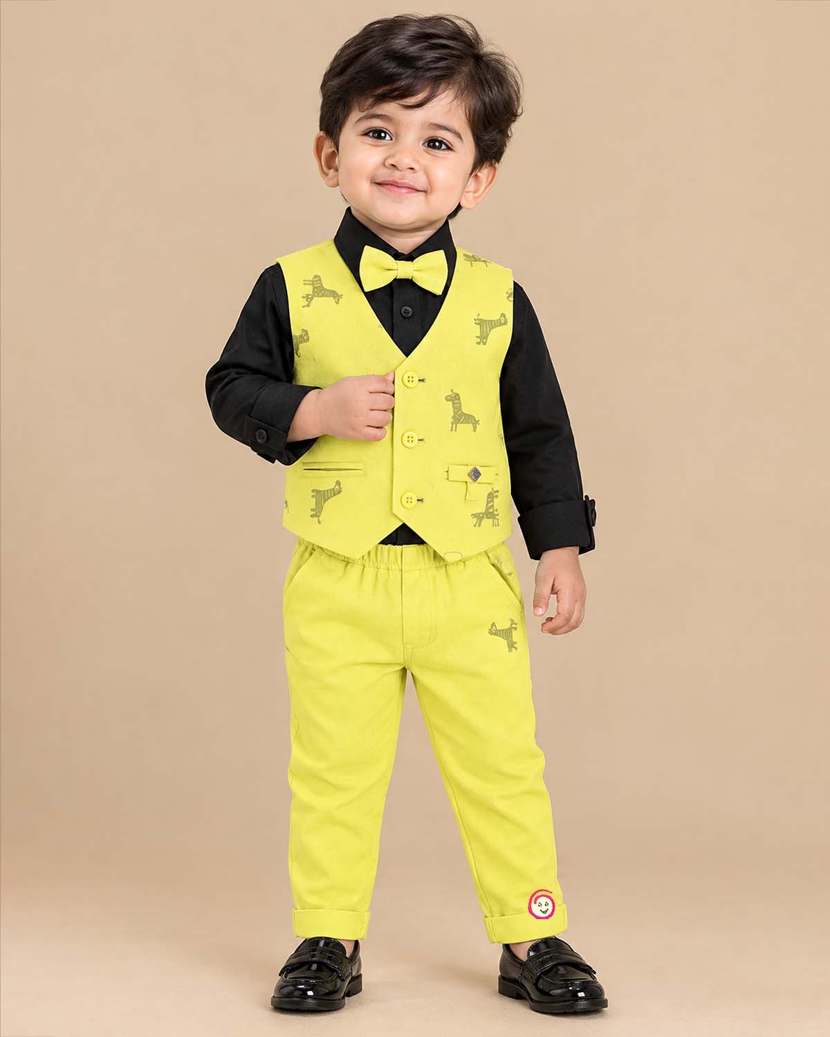 Boys printed waistcoat suit set with shirt, bow tie, and trousers for special occasions.